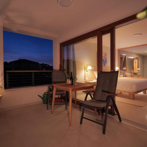 Evening view of the outside balcony lounge and room from balcony