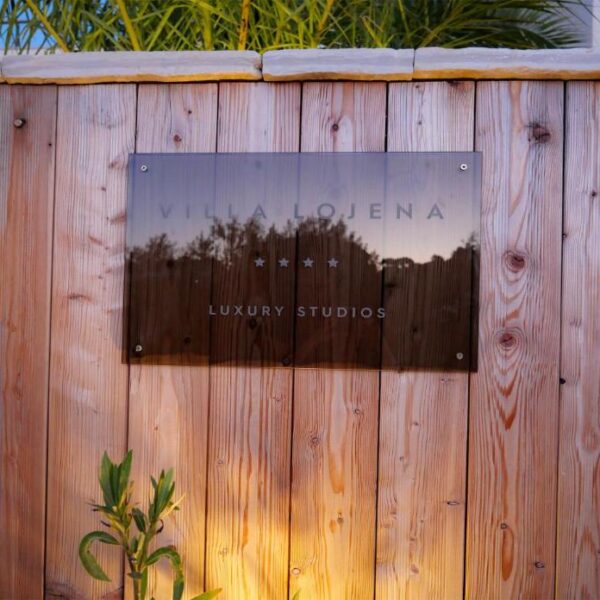 entrance to the villa with glass sign