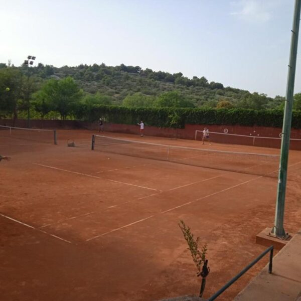 People playing tennis at the tennis court