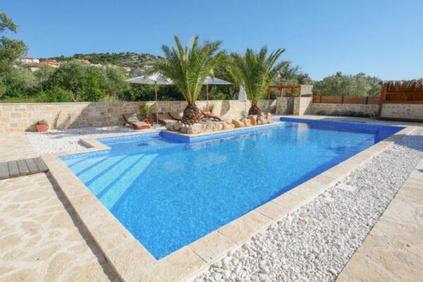 Close up of pool and palms