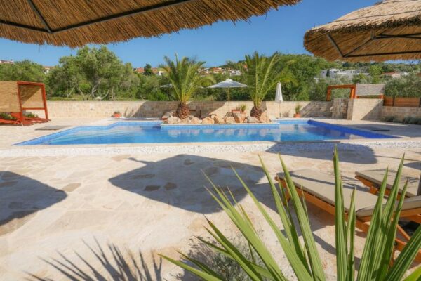 View of terrace and pool during daytime