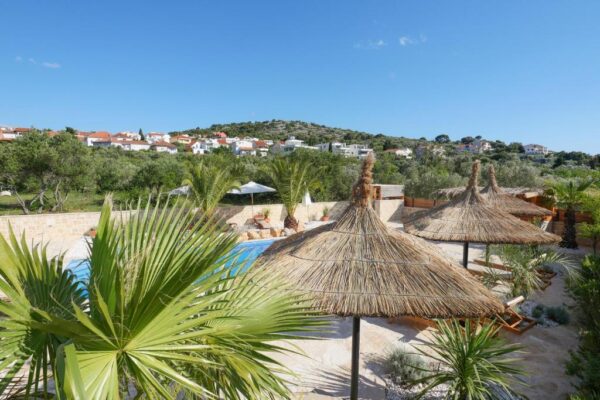 View of terrace and pool during daytime from the air