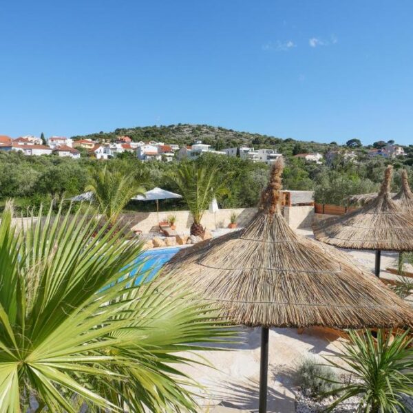 View of terrace and pool during daytime from the air