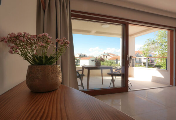 View of the sun covered terrace from the apartment