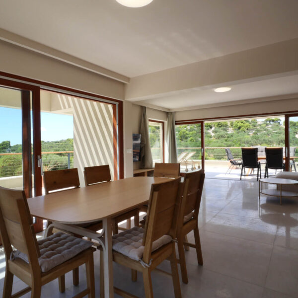 Bright and spacious living room with dining table and sofa